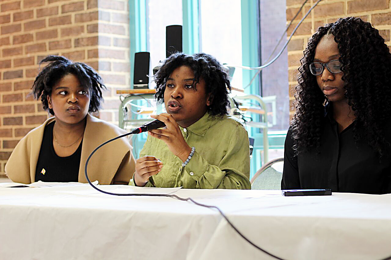 Annette Moukoury (center) participates in an April 14 discussion on the school-to-prison pipeline at Bowie High School. Beside Moukoury are Marie Moukoury (left) and Osato Charles-Omoregbee. (Brigette White/The Washington Informer)