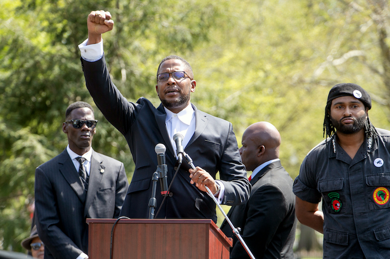 Attorney Malik Zulu Shabazz (center) speaks to those gathered outside the White House for the 10,000 Black Men's March on April 21. (Mark Mahoney/The Washington Informer)