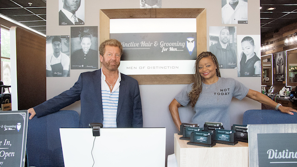 Jim and Deborah Guynn, owners of Distinctive Hair & Grooming for Men (Shevry Lassiter/The Washington Informer)