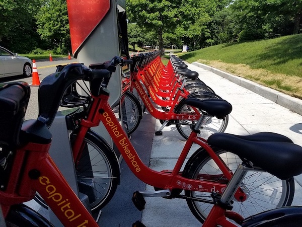 Bikes line a Capital Bikeshare station near the Wayne K. Curry Administration Building in Largo, one of five stations currently in operation in Prince George's County. (William J. Ford/The Washington Informer)