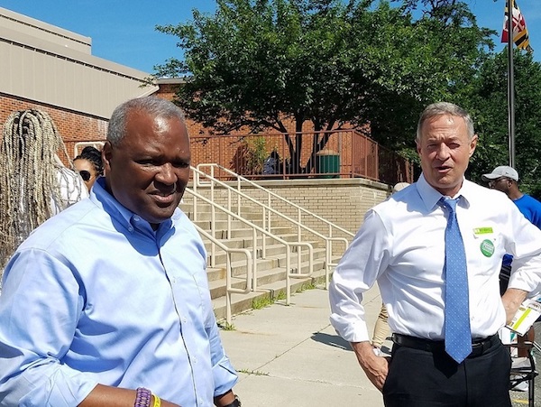 Former Maryland Gov. Martin O'Malley (right) stumps for Prince George's County Executive Rushern L. Baker III, who is running for governor, before he votes June 26 at Gladys Noon Spellman Elementary School in Cheverly in the state's primary election. (William J. Ford/The Washington Informer)