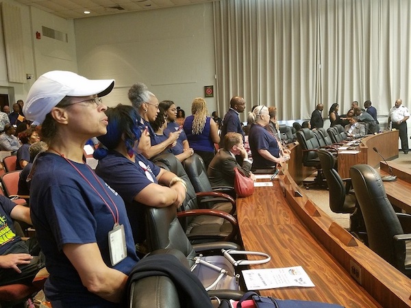 Dozens of educators with the Prince George's County Educators Association attend a June 7 school board meeting in Upper Marlboro, chanting and demanding more accountability and transparency in the school system. (William J. Ford/The Washington Informer)