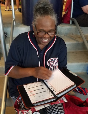Marva Marsh of northwest D.C. shows her Major League Baseball passport at Nationals Park on July 17, before the 89th All-Star Game. (William J. Ford/The Washington Informer)