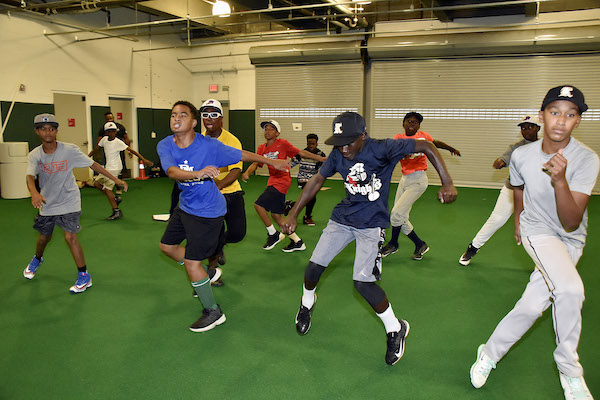 After the Mamie "Peanut" Johnson Little League baseball team won the D.C. Little League Championship on July 24, the team practices at the Nationals Baseball Academy on July 30. According to the Little League schedule, the team advanced to the regional tournament in Bristol, Connecticut, which begins Aug. 5. (Robert R. Roberts/The Washington Informer)