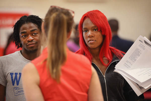 Recruiter Wendy Larsen (C) speaks to Timothy Dykes (L) and Sacara Jackson at a job fair on June 12, 2014 in Chicago, Illinois. According to the Department of Labor's latest jobs report unemployment is at 6.3%, the lowest since 2008 when massive layoffs swept through the country. (Photo by Scott Olson/Getty Images)