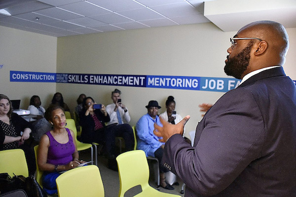 Walter L. Simmons (right), president and CEO of Employ Prince George's, talks about a new program geared toward residents ages 18 to 24 at the county's Youth Career Center in Suitland, Maryland, on Aug. 29. (Robert Roberts/The Washington Informer)