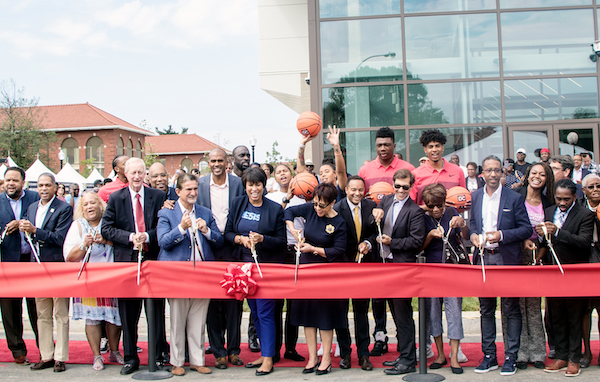D.C. Mayor Muriel Bowser, Council members Jack Evans (D-Ward 2), Anita Bonds (D-At Large), Kenyan McDuffie (D-Ward 5), Brandon Todd (D-Ward 4) and Trayon White (D-Ward 8), Ed Fisher, executive director of St. Elizabeths East Campus, and Greg O’Dell, president and CEO of EventsDC, along with other officials and Ward 8 residents, cut the ribbon for the new Sports and Entertainment Arena in Southeast on Sept 22. (Shevry Lassiter/The Washington Informer)