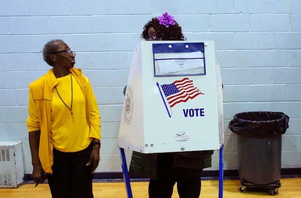 **FILE** A voter asks an election worker a question as she votes at Samuels Community Center in the presidential election in the Harlem neighborhood of New York City on Nov. 8, 2016. (Kena Betancur/AFP/Getty Images)