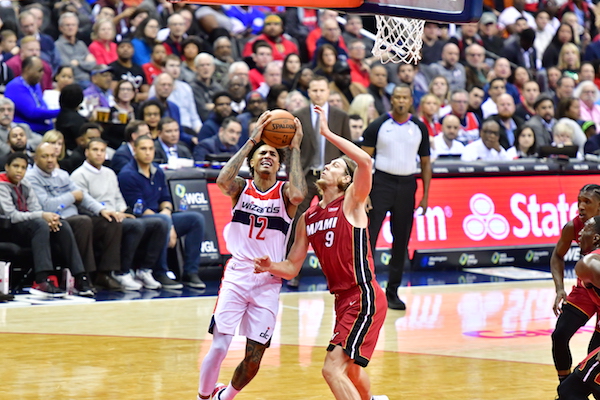 Washington Wizards forward Kelly Oubre Jr. drives against Miami Heat center Kelly Olynyk during the Heat's 113-112 win at Capital One Arena in D.C. on Oct, 18. (John E. De Freitas/The Washington Informer)