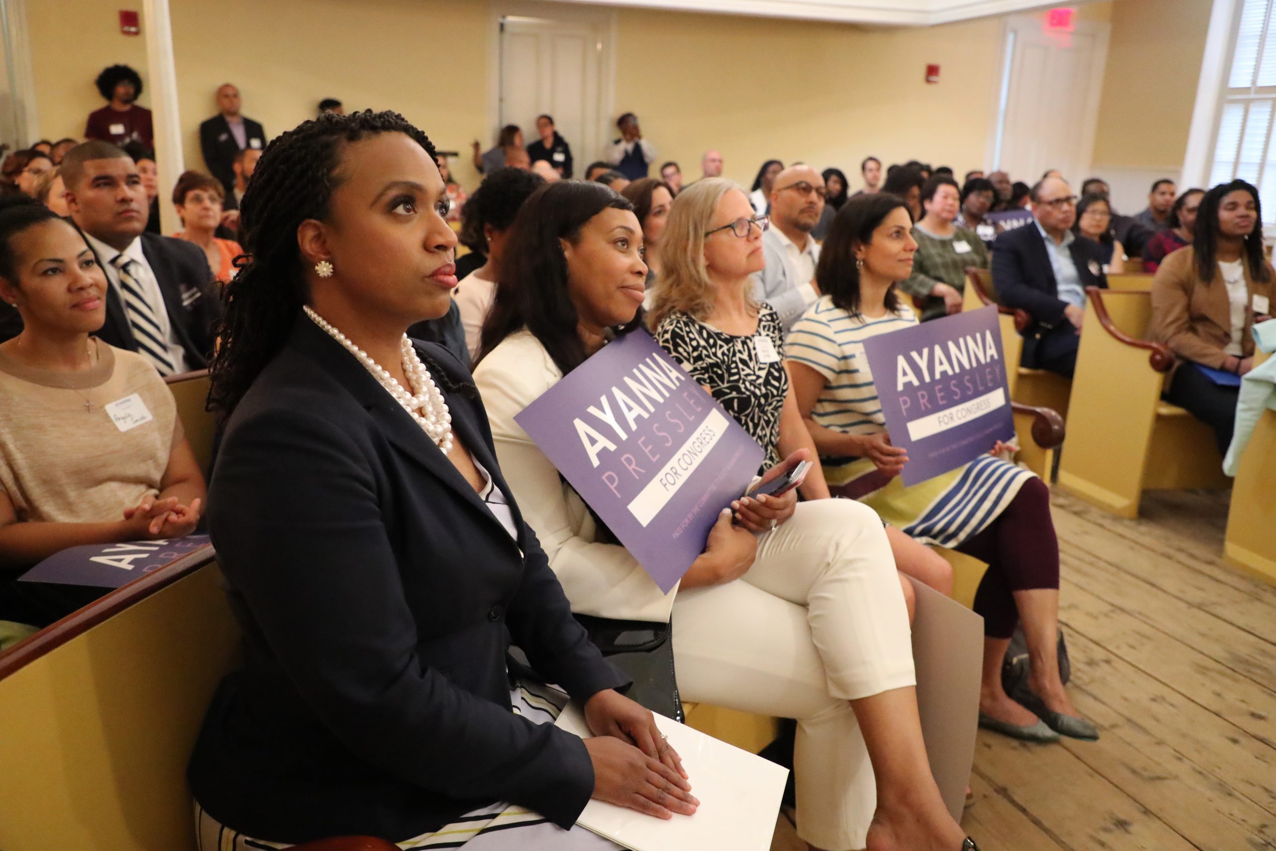 **FILE** Massachusetts Congressional candidate and Boston City Councilor Ayanna Pressley listens as Suzanne Lee introduces her during a campaign fundraiser and event for communities of color at the Museum of African American History in Boston on May 22, 2018. Pressley is challenging incumbent Michael Capuano for the Seventh Congressional District seat. (Photo by Matthew J. Lee/The Boston Globe via Getty Images)