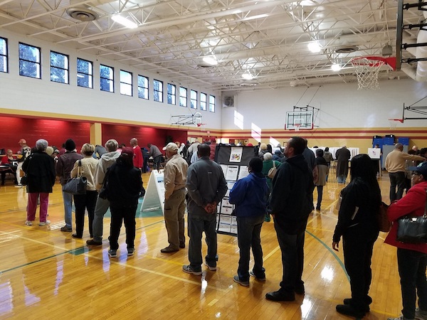 Dozens of Prince George's County residents line up at Upper Marlboro Community Center on Oct. 25, the first day of early voting for the Maryland general election. (William J. Ford/The Washington Informer)