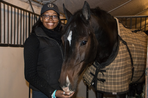 Jordan Allen, 17, shows off Carloe, the horse she rode during the Washington International Horse Show held at the Capital One Arena in D.C. this month. (Shevry Lassiter/The Washington Informer)