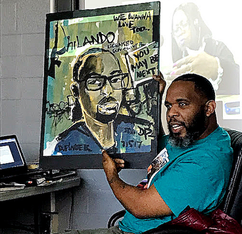 Demont "Picasso" Pinder, whose paintings often depict victims of violence throughout the country and the world, says his "calling is using my God-given gift to bring a smile to the families that have gone through this tragic situation." (DR Barnes/The Washington Informer)