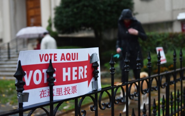 A sign announcing the location of a polling station is seen outside a church in Washington, D.C., on Nov. 6, 2018. (Photo by MANDEL NGAN/AFP/Getty Images)