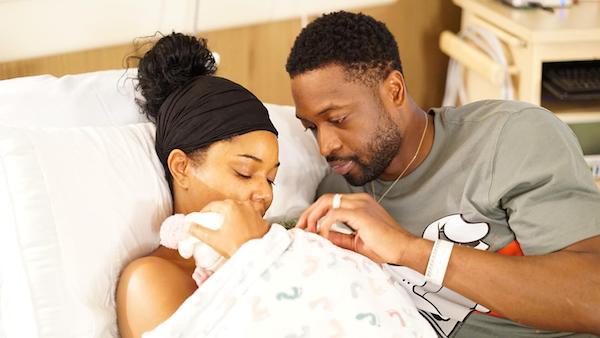 NBA star Dwyane Wade posted a photo online of himself with his wife, actress Gabrielle Union, and their newborn daughter, born Nov. 7 via a surrogate.