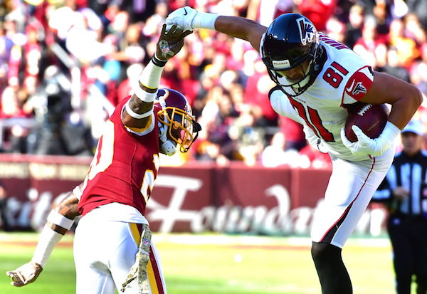 Atlanta Falcons tight end Austin Hoopaer goes airborne to make a reception while defended by Washington Redskins safety Ha Ha Clinton-Dix during Atlanta's 38-14 win at FedEx Field in Landover, Md., on Nov. 4. (John E. De Freitas/The Washington Informer)