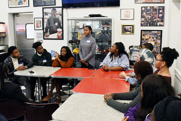 Lauryn Renford, student spokesperson for Thurgood Marshall Academy, shares why she and her classmates produced a Stop the Violence video at Ben's Chili Bowl in northwest D.C. on Nov. 8. (Roy Lewis/The Washington Informer)