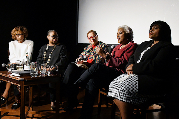 Political analyst Donna Brazile (second from right) tells stories about her election night TV appearances during a post-election panel discussion at Busboys and Poets in Northeast on Nov. 7. The panelists were (from left) Yolanda Caraway, Rev. Leah Daughtry, panel moderator Julianne Malveaux, Brazile and Minyon Moore. (Roy Lewis/The Washington Informer)