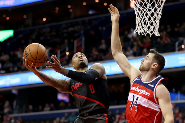Damian Lillard #0 of the Portland Trail Blazers shoots against Jason Smith #14 of the Washington Wizards during the second half at Capital One Arena on November 18, 2018 in Washington, DC. (Photo by Will Newton/Getty Images)