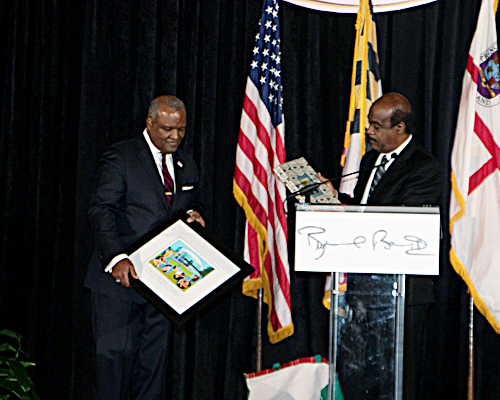 Montgomery County Executive Isiah Leggett (at podium) celebrates the birthday and farewell celebration for Prince George's County Executive Rushern L. Baker III (left) at the Camelot by Martin's in Upper Marlboro on Nov. 19. (Shevry Lassiter/The Washington Informer)