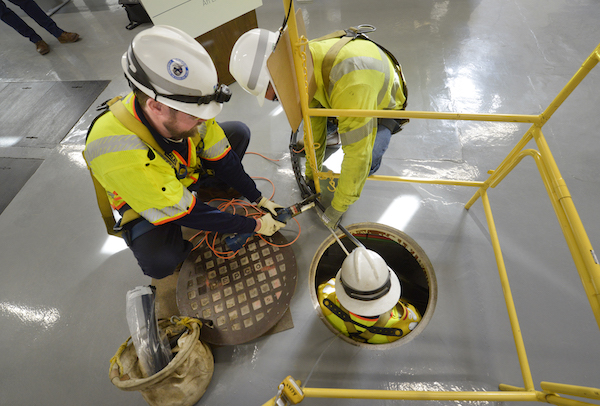 Pepco line worker trainees perform a demonstration of underground utility repairs at the Nov. 29 Winter Readiness news conference. (Courtesy of Pepco)