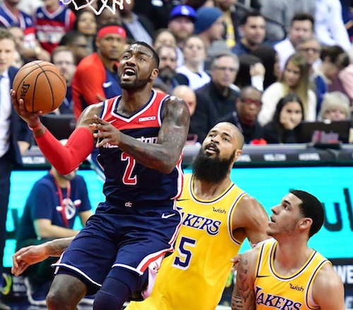 Washington Wizards guard John Wall drives to the basket during the Wizards' 128-110 victory over the Los Angeles Lakers at Capital One Arena in D.C. on Dec. 16. (John De Freitas/The Washington Informer)