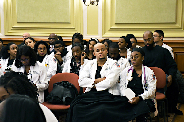 Howard University Medical School students attend a D.C. Council legislative meeting on Dec. 4 to show support of Howard's inclusion in a Ward 8 hospital in northwest D.C. (Roy Lewis/The Washington Informer)