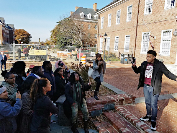 Jose Garcia (right), a student at the University of Maryland Eastern Shore, speaks during a Dec. 8 rally in Annapolis to support full and equal funding for his and the state's three other historically Black colleges and universities. (William J. Ford/The Washington Informer)
