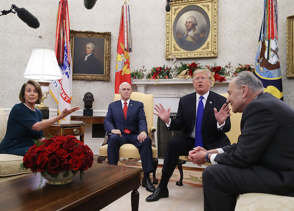President Donald Trump (second from right) argues about border security with Senate Minority Leader Chuck Schumer (right) (D-N.Y.) and House Minority Leader Nancy Pelosi (D-Calif.) as Vice President Mike Pence sits nearby in the Oval Office of the White House in Washington, D.C., on Dec. 11, 2018. (Mark Wilson/Getty Images)
