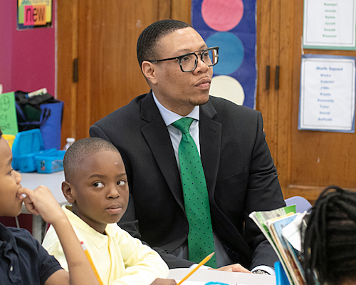 Dr. Lewis Ferebee visits a classroom at Ann Beers Elementary School in Southeast. (Shevry Lassiter/The Washington Informer)