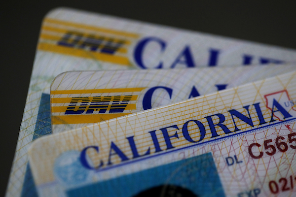 In this photo illustration, the California Department of Motor Vehicles (DMV) logo appears on a California driver license on May 9, 2017 in San Anselmo, California. (Photo Illustration by Justin Sullivan/Getty Images)