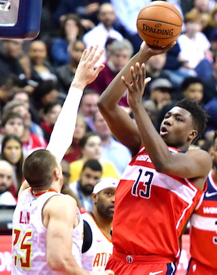 Washington Wizards center Thomas Bryant attempts a short jumper over Atlanta Hawks center Alex Len in the first half of the Wizards' 114-98 win at Capital One Arena in D.C. on Jan. 2. (John E. De Freitas/The Washington Informer)