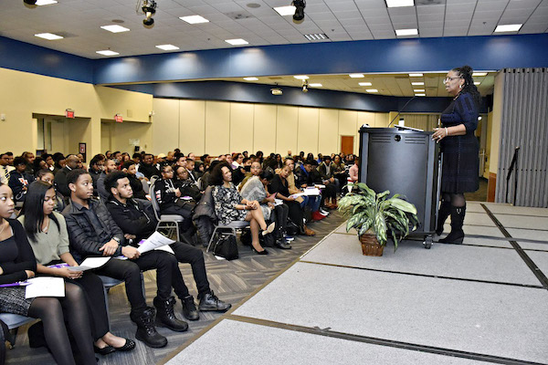 Cecilia Knox, who works at Prince George's Community College, explains part of the Summer Youth Enrichment Program during a kickoff event at the college in Largo on Jan. 5. (Robert Roberts/The Washington Informer)