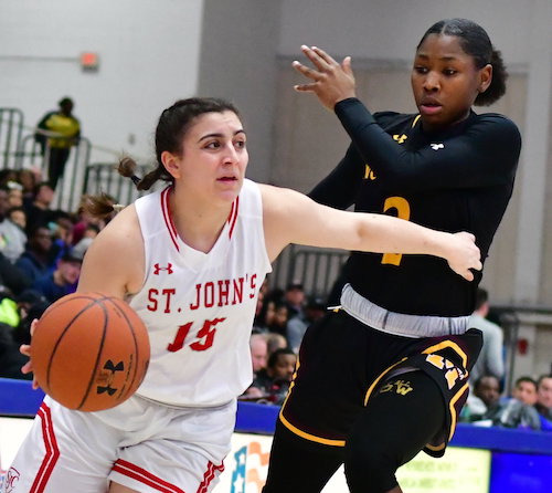 St. John's Cadets guard Carly Rivera drives past Bishop McNamara Mustangs guard Aliyah Matharu during the Cadets' 66-51 win at American University Sports Complex in D.C. on Feb. 25. (John E. De Freitas/The Washington Informer)