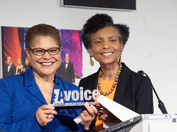 Elsie Scott, interim president and CEO of the Congressional Black Caucus Foundation, Inc., presents the Distinguished Champion for Global Black Empowerment award to Congressional Black Caucus Chair Karen Bass (D-Calif.) during the 2019 Avoice Heritage Celebration in northwest D.C. on Feb. 26. (Shevry Lassiter/The Washington Informer)