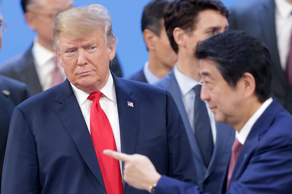 **FILE** U.S. President Donald Trump looks at Prime Minister of Japan Shinzo Abe after the family photo on the opening day of Argentina G20 Leaders' Summit 2018 at Costa Salguero on Nov. 30, 2018. (Daniel Jayo/Getty Images)