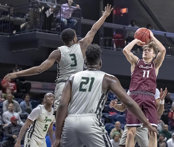 Sidwell Friends guard Jason Gibson shoots a jumper during the team's upset win over top-ranked Wilson in the DCSAA state championship game on March 3. (Yusef Abdullah/The Washington Informer)