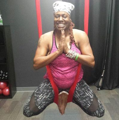 Southeast resident Katrina Wyder shows off her skills during a session of aerial yoga at 2D Pole & Fit in Fort Washington, Md., led by instructor Dawn Thomas. (Courtesy photo)