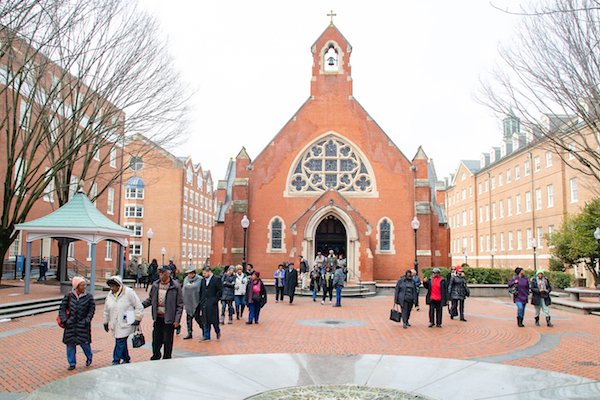 The Washington Informer African American Heritage Tour on the campus of Georgetown University at Dahlgren Chapel of the Sacred Heart, which was built in 1893 (Shevry Lassiter/The Washington Informer)