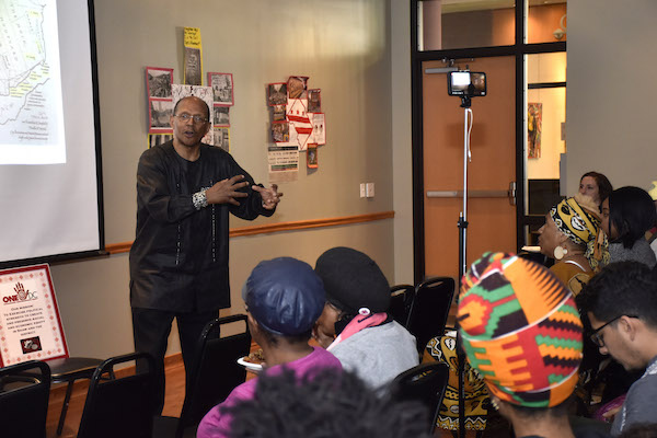 Historian C.R. Gibbs lectures students about the many plantations located in and around Washington, D.C., Maryland and Virginia and how life was for African Americans during the time of Emancipation until the present day at Emancipation Day Freedom School held at THEARC in southeast D.C. on April 16. (Robert Roberts/The Washington Informer)
