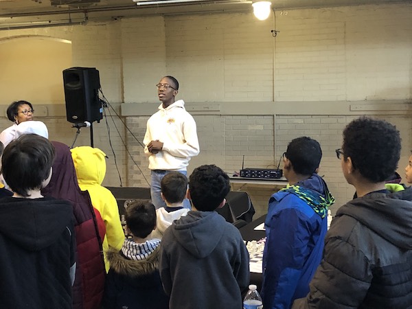 D.C. chess phenom Zahir Muhammad speaks to a group of students in February before they participate in the Black History Month chess tournament at the Thurgood Marshall Center for Service and Heritage in northwest D.C. (Courtesy photo)