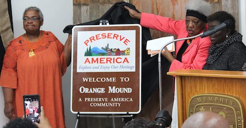 Orange Mound activists Angela Barksdale and Mary Mitchell help unveil a new "Preserve America" sign, a distinction Orange Mound first received during the Obama administration. A federal program administered by the Advisory Council on Historic Preservation, Preserve America encourages community efforts to preserve and enjoy the country’s cultural and natural heritage. (Lee Eric Smith/New Tri-State Defender via NNPA Newswire)