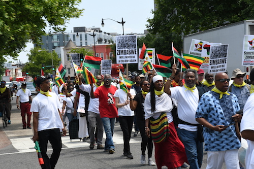 Protesters march May 25 from the African American Civil War Memorial on U Street in northwest D.C. to the White House, opposing U.S. economic sanctions against Zimbabwe. (Roy Lewis/The Washington Informer)