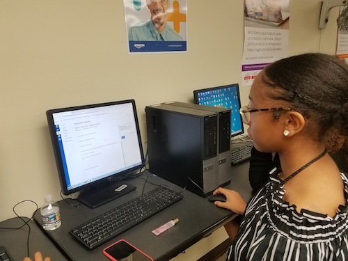 Trinity Jones, a senior at Gwynn Park High School in Brandywine, Md., reviews coding work the class conducted this year as part of Amazon Future Engineer program. (William J. Ford/The Washington Informer)