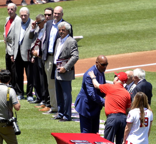 Washington Redskins great Charles Mann, one of the 10 newest members of the D.C. Sports Hall of Fame, is greeted during a induction ceremony prior to Washington Nationals' game against the Atlanta Braves at Nationals Park in D.C. on Sunday, June 23. (John E. De Freitas/The Washington Informer)