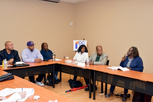 Health advocates, hospital workers and residents discuss the health care needs of East of the River and the impending closure of United Medical Center during an event sponsored by the DC Health Justice Coalition in Southeast on July 11. (Anthony Tilghman/The Washington Informer)