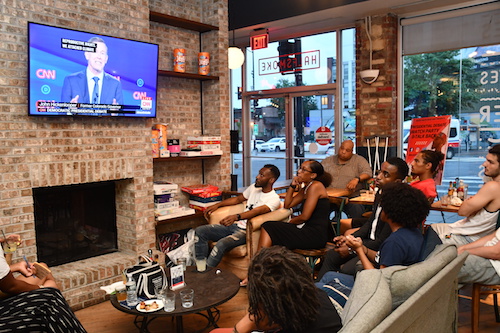 Young people gathered at Halfsmoke in Northwest on Tuesday, July 30 to watch the first night of the second round of Democratic debates with members of #BlackYouthVote. (Anthony Tilghman/The Washington Informer)