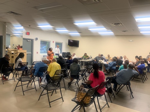 Prince George's County residents discuss their disapproval of a proposed logistics center during a community meeting at the newly constructed Peppermill Community Center in Hyattsville on July 27. (Anthony Tilghman/The Washington Informer)