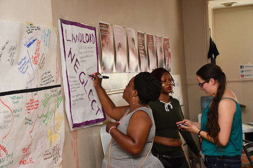 Detrice Belt, head of the Barry Farm Tenants and Allies Association, takes notes on landlord neglect during the People’s Right to Housing Assembly hosted by One DC at the Black Workers and Wellness Center in southeast D.C. on July 6. (Anthony Tilghman/The Washington Informer)