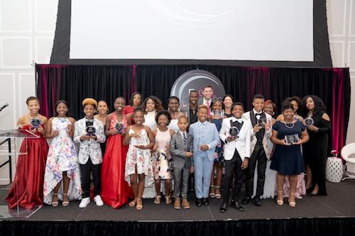 Youth honorees from across the nation are presented with awards by Gabrielle Jordan at the ExCEL Honors 2019 fala and fundraiser on June 21. (Brigette Squire/The Washington Informer)